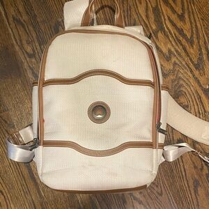 DELSEY Paris Neutral Cream Canvas Backpack with Tan Trim